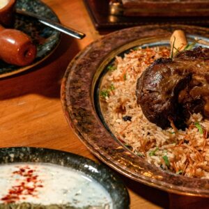 Appetizing lamb biryani served with rice and spices in a traditional setting.