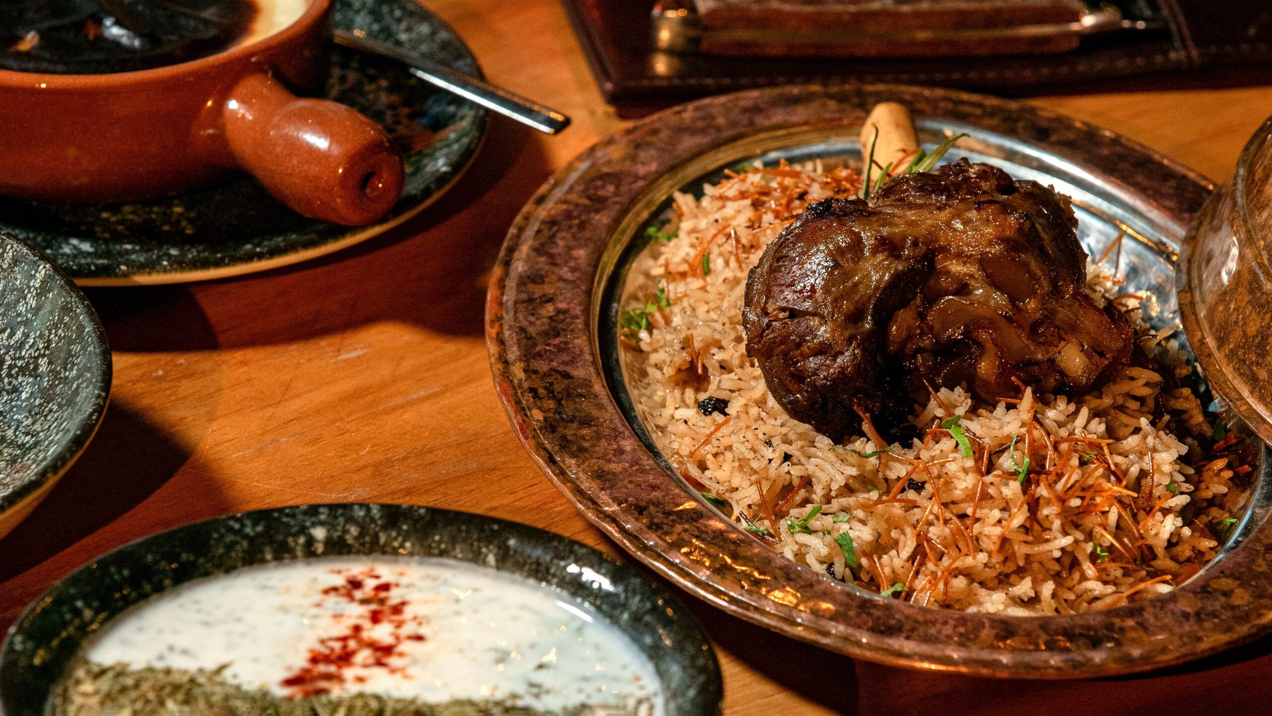 Appetizing lamb biryani served with rice and spices in a traditional setting.